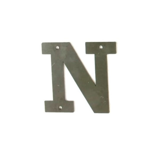 Metal letter N in raw steel