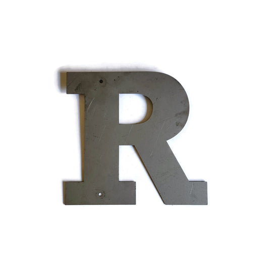Metal letter R in raw steel