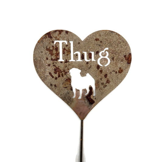 Custom heart-shaped rusty garden stake sign in rust with a pug silhouette and Thug for text