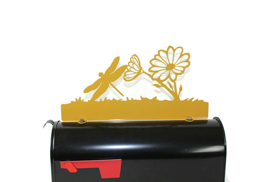 Yellow dragonfly and daisy custom mailbox topper installed on a mailbox.