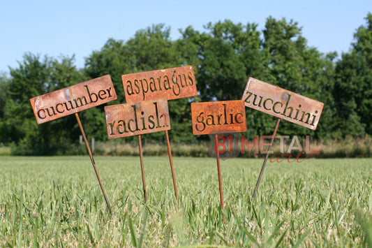 Rusty garden markers for cucumber, radish, asparagus, garlic, and zucchini