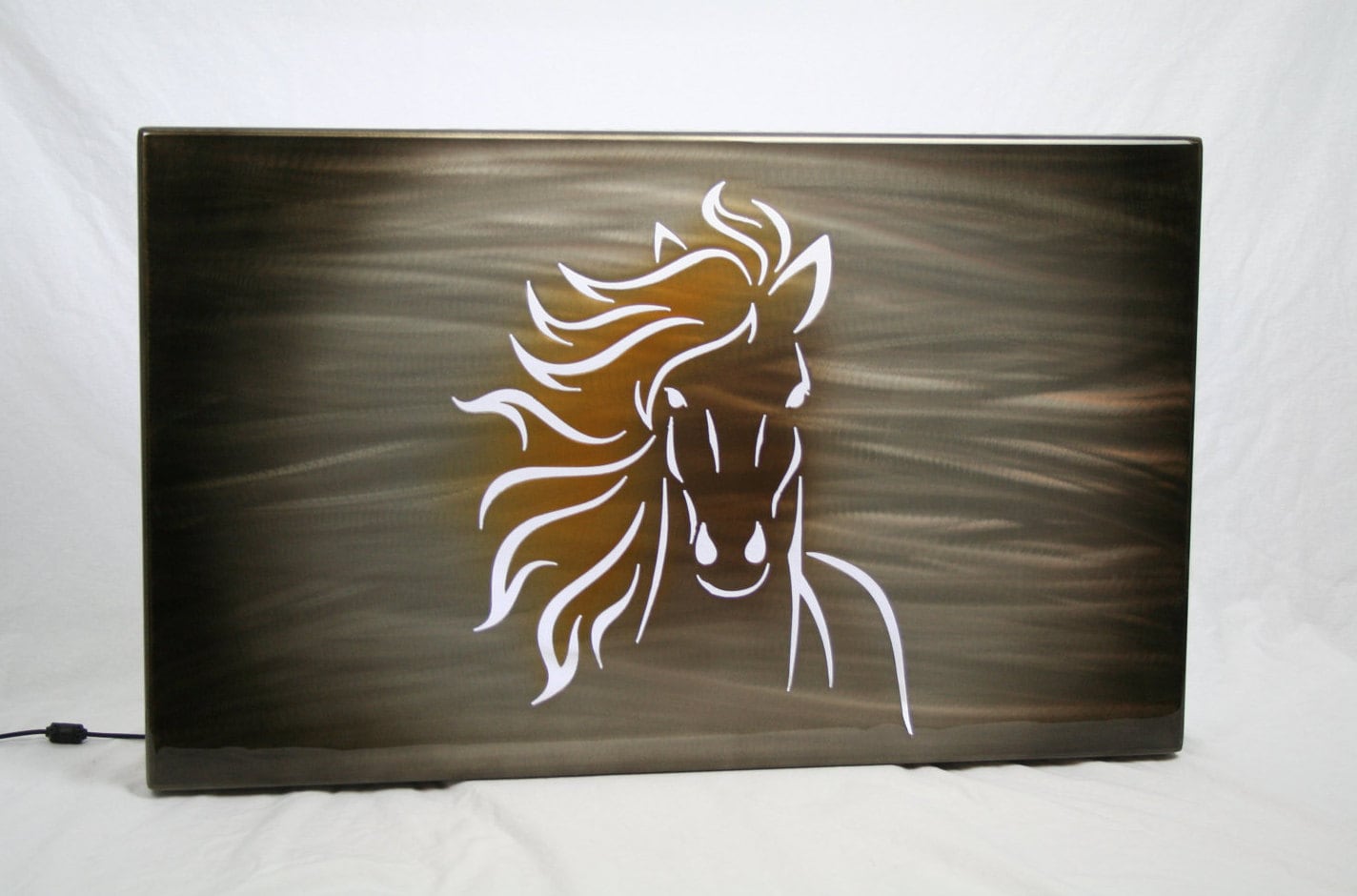 Running horse face silhouette with LED backlighting