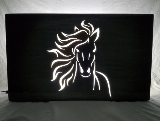 Running horse face silhouette with LED backlighting at night