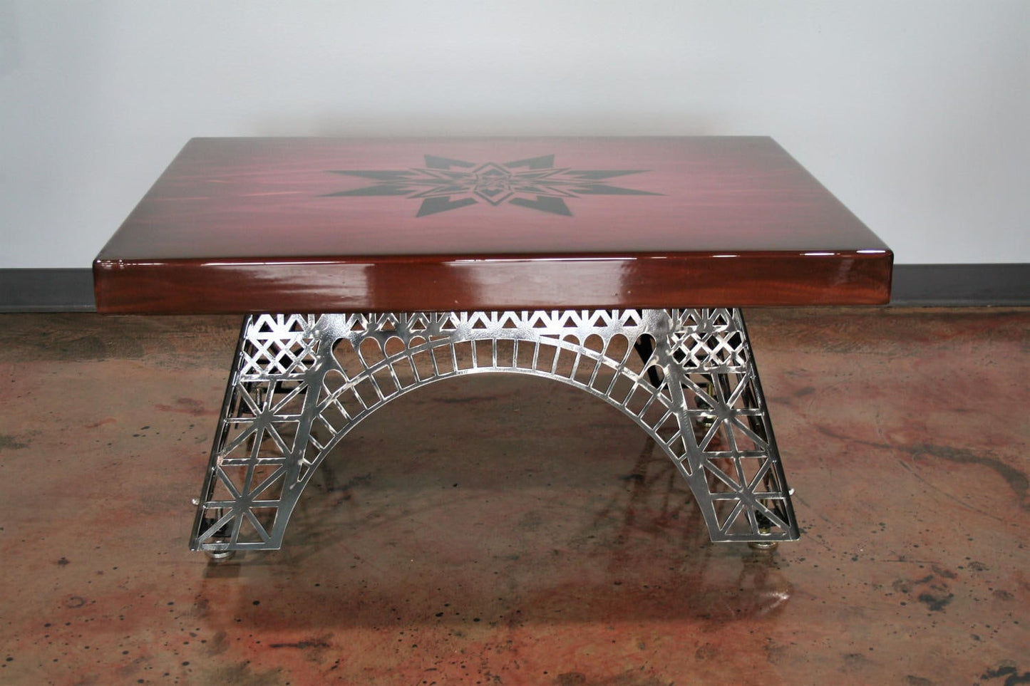 Steel Eiffel Tower coffee table base with aluminum panel coffee table top in clear coat