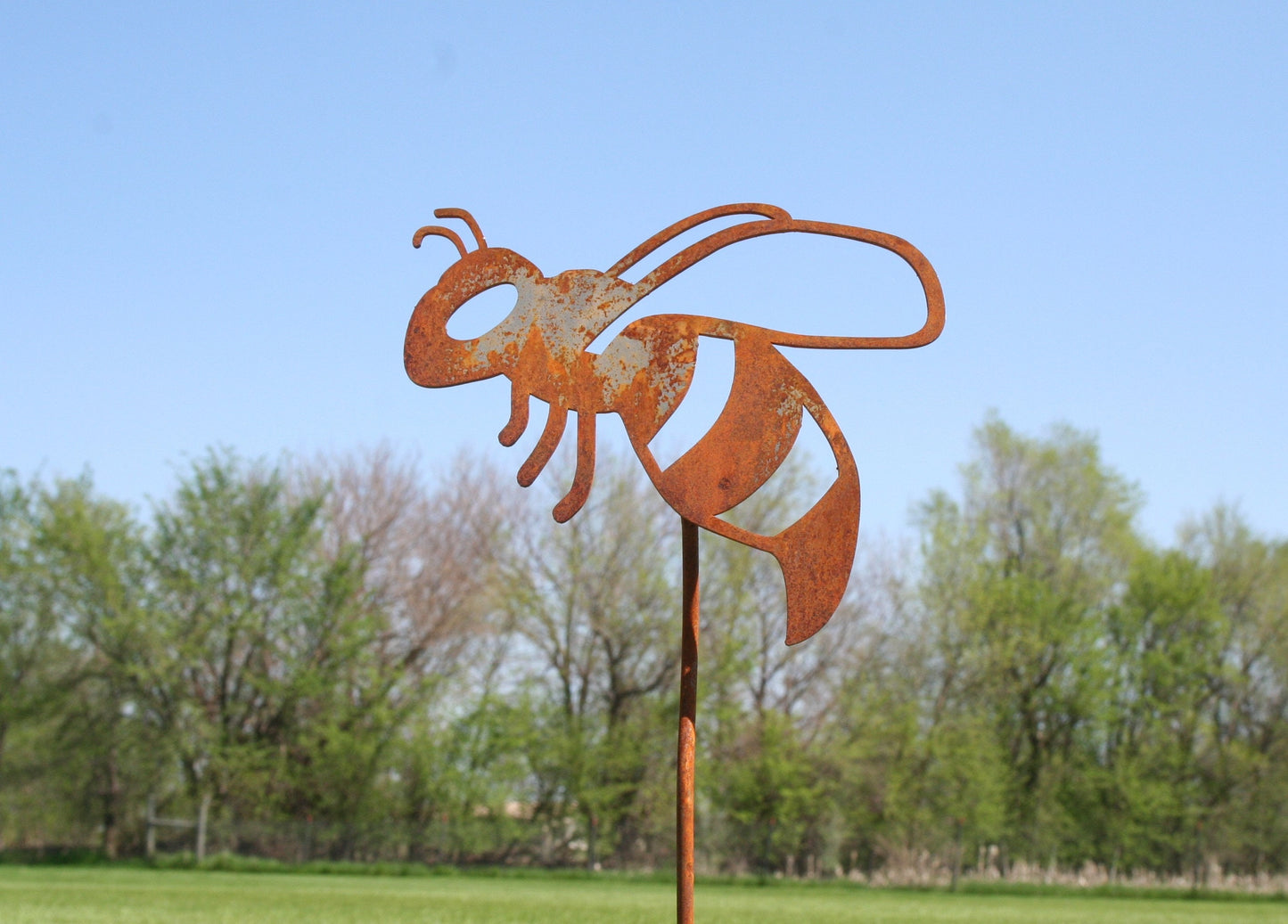 Rusty metal honey bee stake
