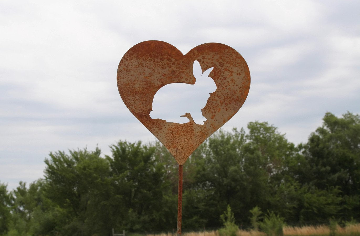 Custom heart-shaped rusty garden stake sign in rust with a bunny rabbit silhouette
