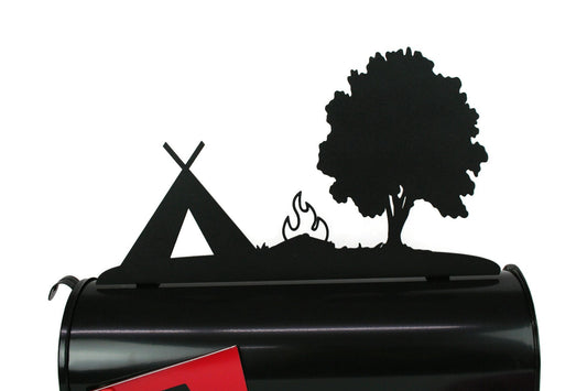 Black tent, tree, and campfire mailbox topper installed on a mailbox