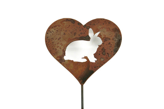 Heart-shaped rusty garden stake sign in rust with a bunny rabbit silhouette