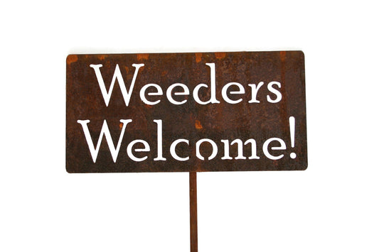 Weeders Welcome rusty garden stake sign