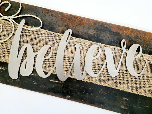 believe metal script word sign in raw steel