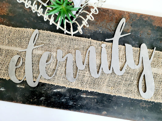eternity metal script word sign in raw steel
