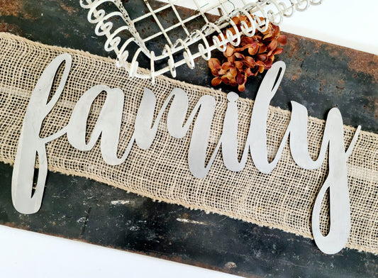 family metal script word sign in raw steel