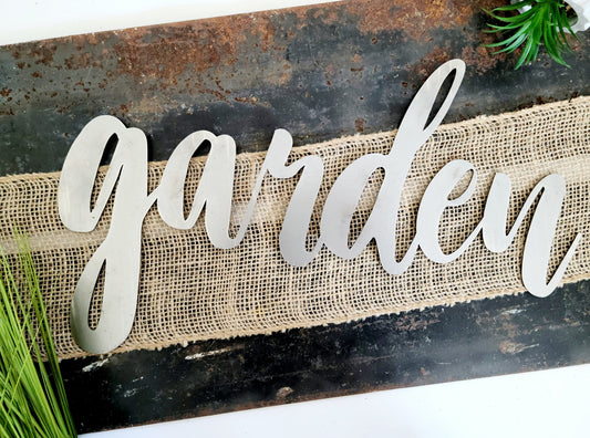 garden metal script word sign in raw steel