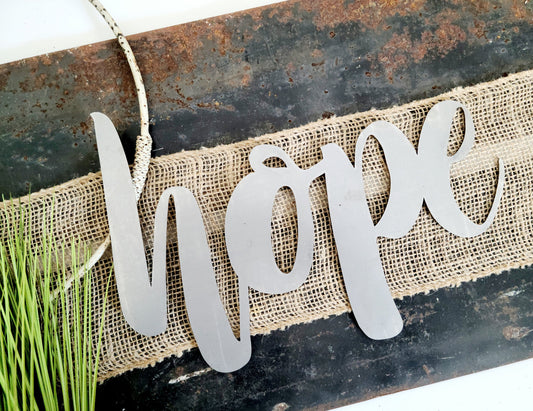 hope metal script word sign in raw steel