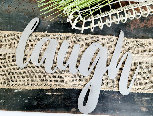 laugh metal script word sign in raw steel