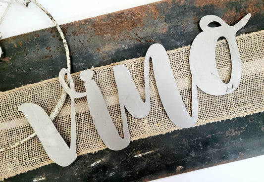 vino metal script word sign in raw steel