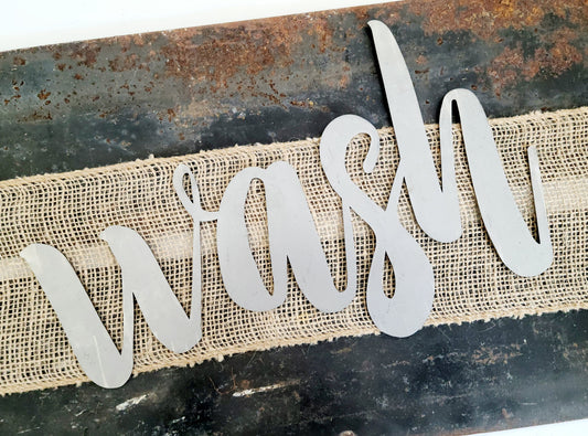 wash metal script word sign in raw steel