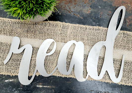 read metal script word sign in raw steel