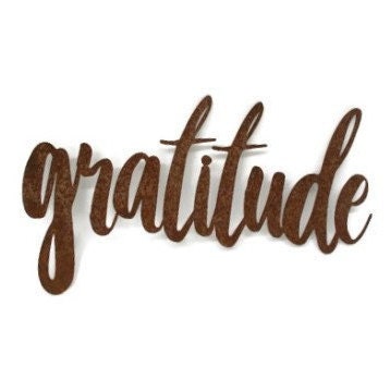 gratitude metal script word sign in rust