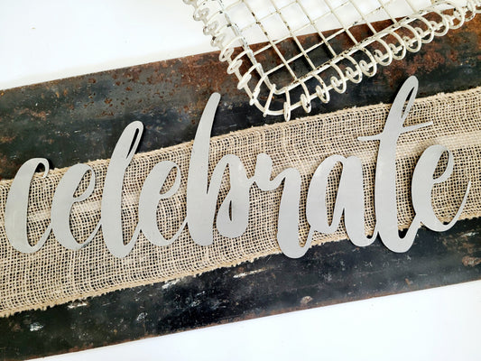 celebrate metal script word sign in raw steel