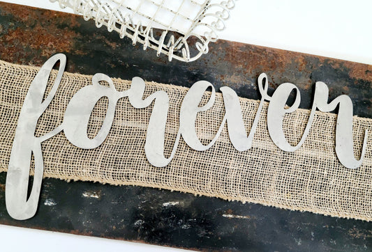 forever metal script word sign in raw steel