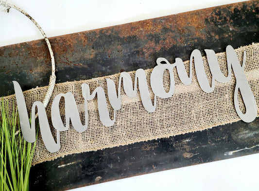 harmony metal script word sign in raw steel