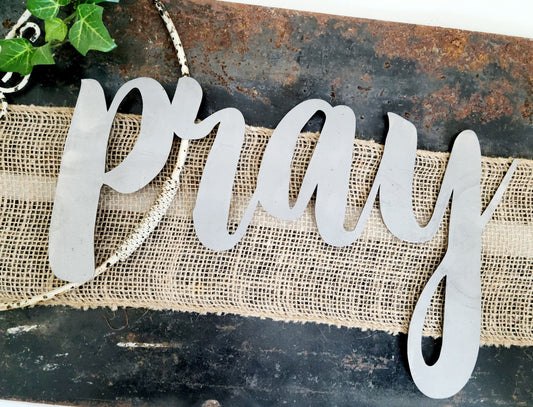 pray metal script word sign in raw steel