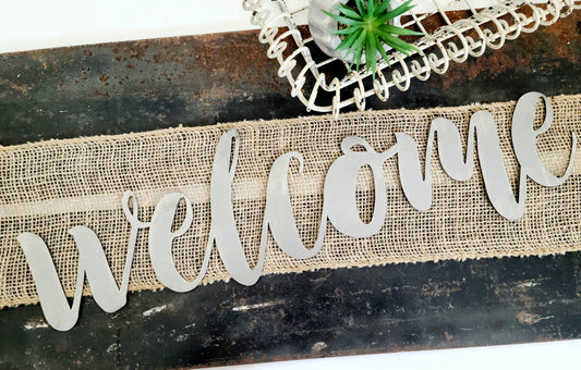 welcome metal script word sign in raw steel