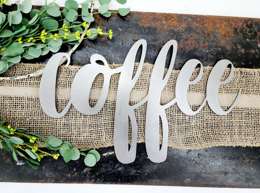 coffee metal script word sign in raw steel