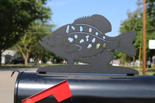 Black crappie fish mailbox topper installed on a mailbox.