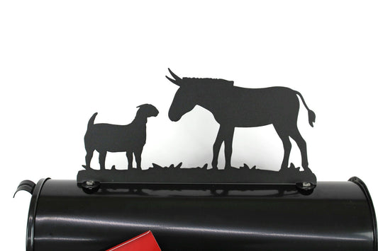 Black donkey and goat mailbox topper installed on a mailbox.