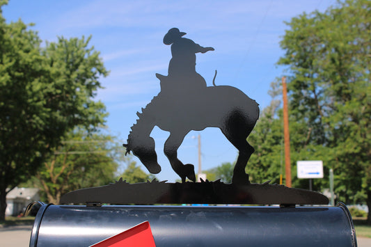 Starry night black bucking rodeo bronco mailbox topper installed on a mailbox