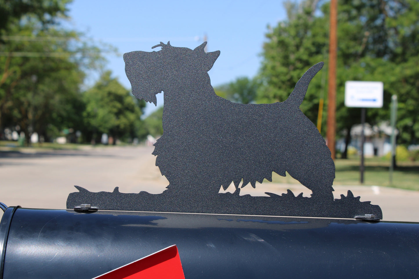 Black Scottish Terrier mailbox topper installed on a mailbox