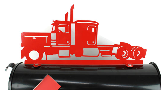 Red semi truck mailbox topper installed on a mailbox