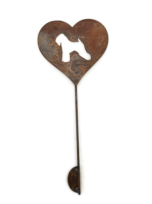 Heart-shaped rusty garden stake sign in rust with a soft coated wheaten terrier dog silhouette