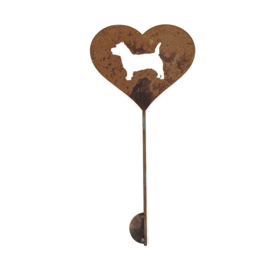 Heart-shaped rusty garden stake sign in rust with a cairn terrier silhouette