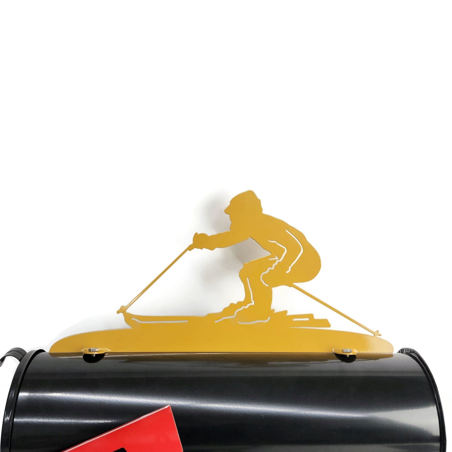 Yellow downhill skiing mailbox topper installed on a mailbox.