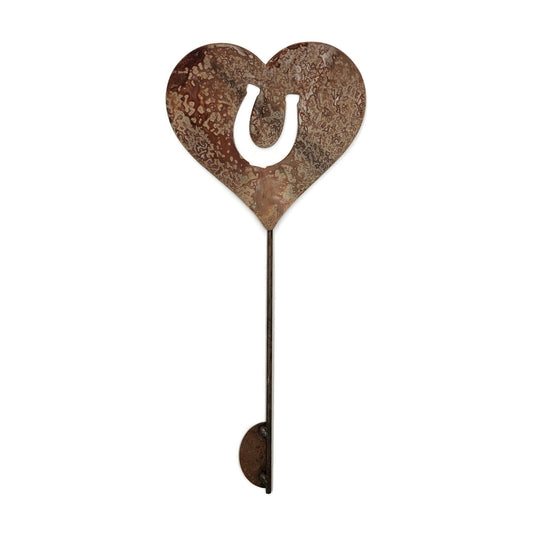 Metal heart shaped garden stake sign with a horseshoe in rust