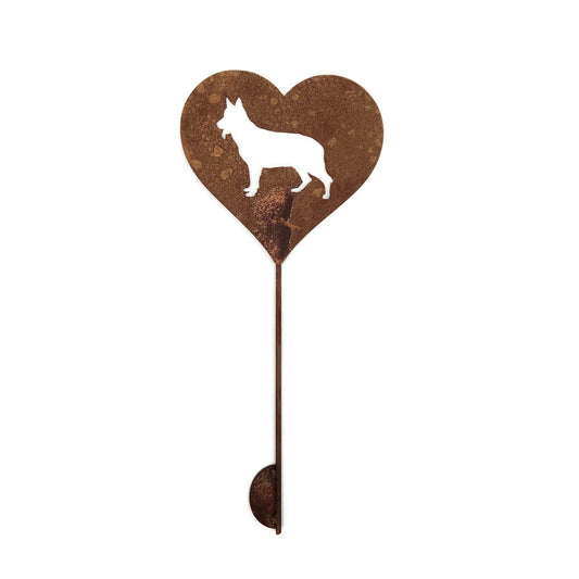 Heart-shaped rusty garden stake sign in rust with a german shepherd dog silhouette