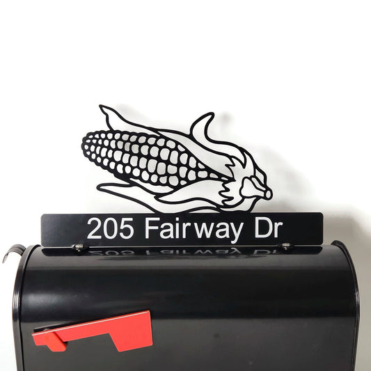 Black ear of corn custom mailbox topper with address installed on a mailbox.