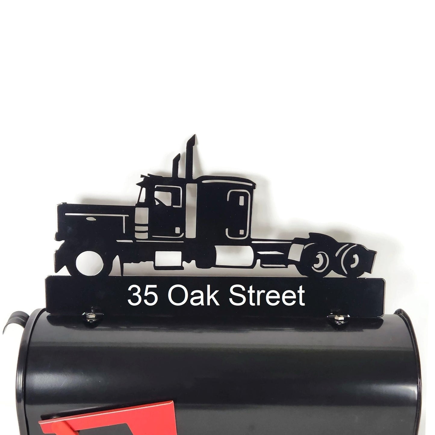 Black semi truck custom mailbox topper with address installed on a mailbox