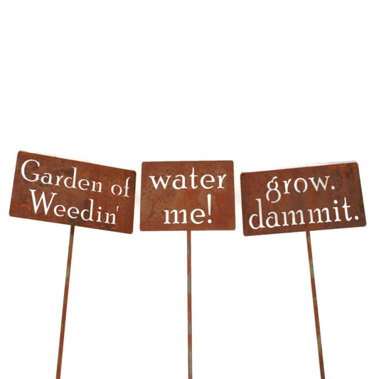 grow dammit, water me, and Garden of Weedin rusty garden stake signs
