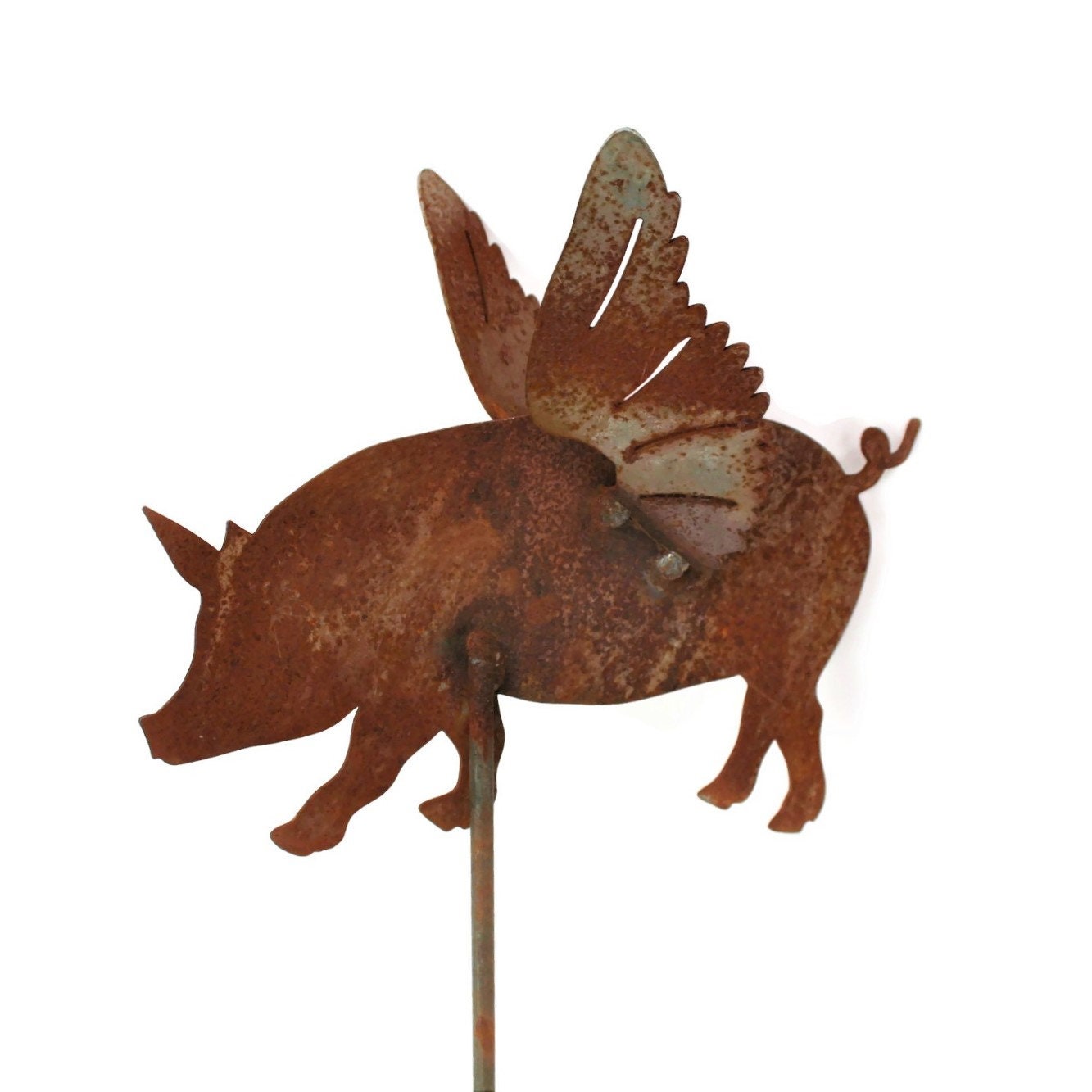 Metal flying pig garden stake in rust