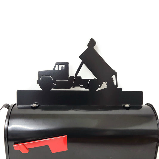 Black dump truck custom mailbox topper installed on a mailbox.