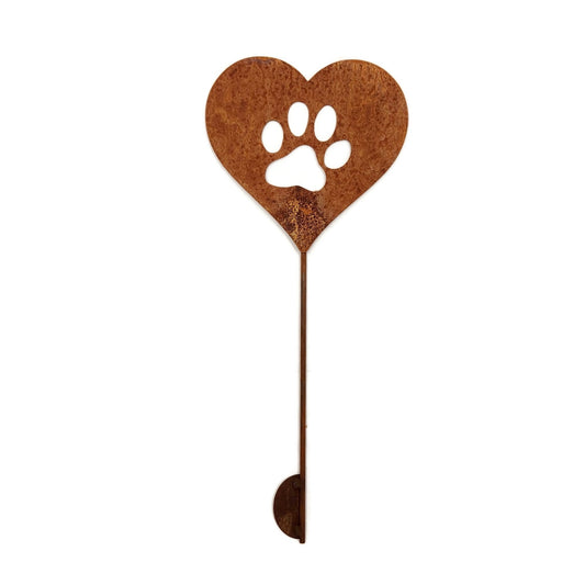 Heart-shaped rusty garden stake sign in rust with a paw cut out