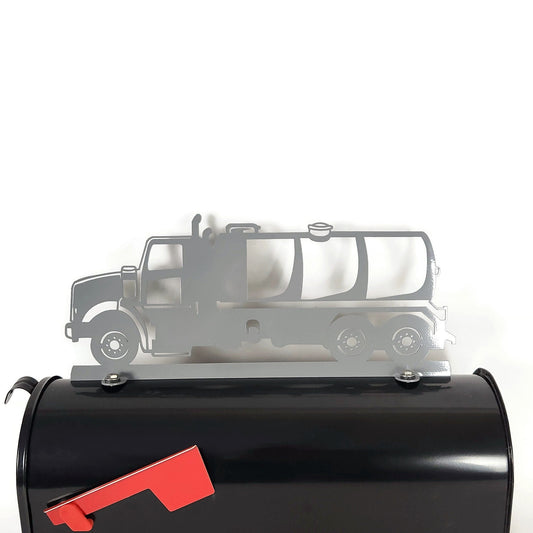 Gray pump truck mailbox topper installed on a mailbox