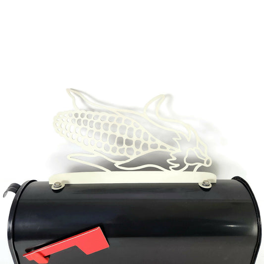 Cream ear of corn mailbox topper installed on a mailbox.