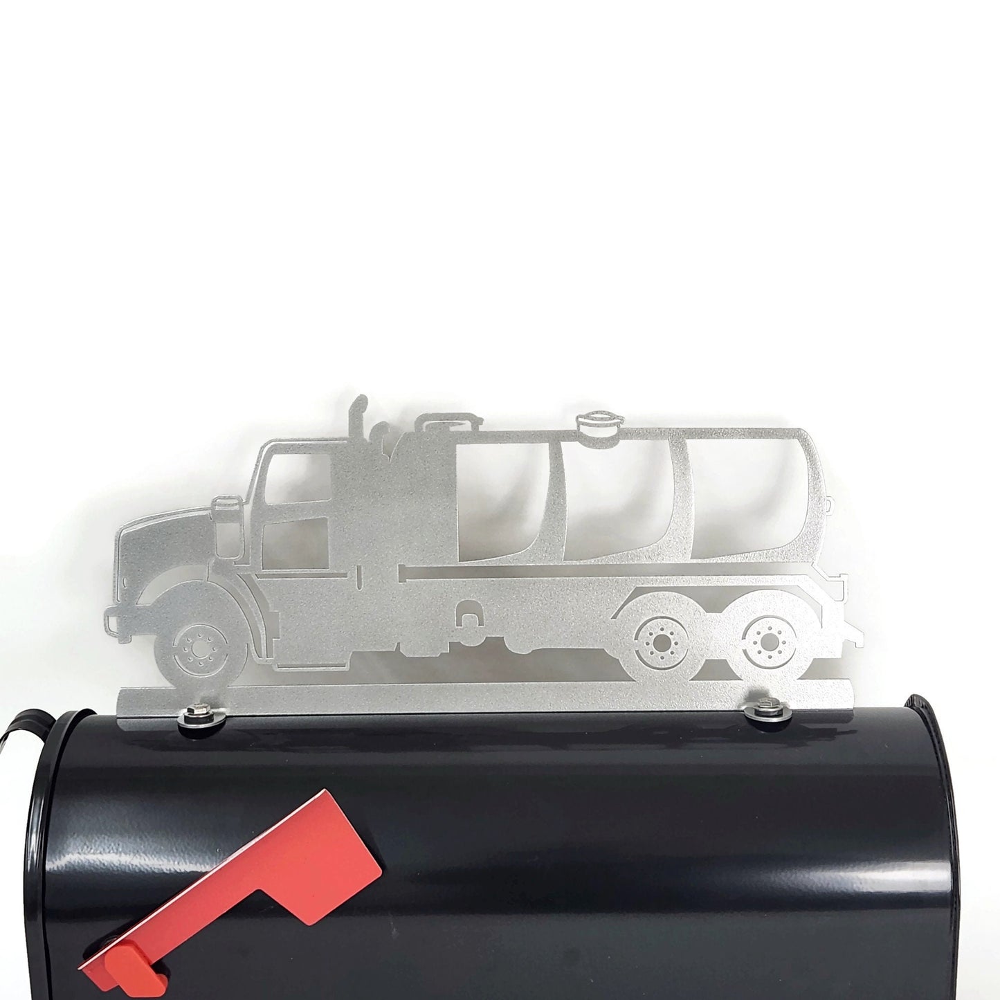 Silver pump truck mailbox topper installed on a mailbox