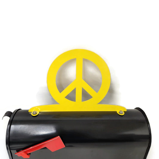 Yellow peace sign mailbox topper installed on a mailbox