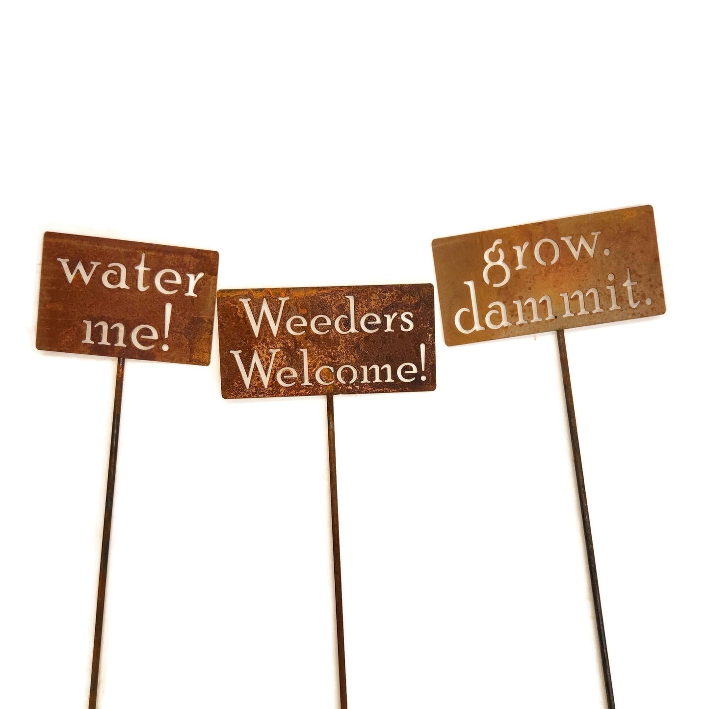 grow dammit, water me, and weeders welcome rusty garden stake signs